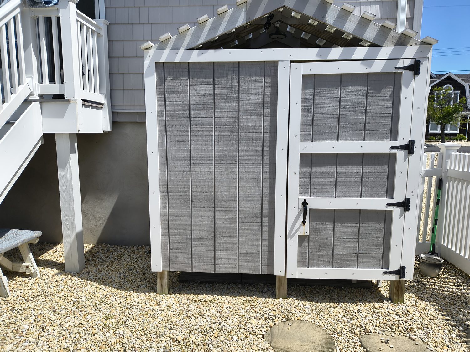 Outdoor stall from outside, cedar shingles and gabled roof