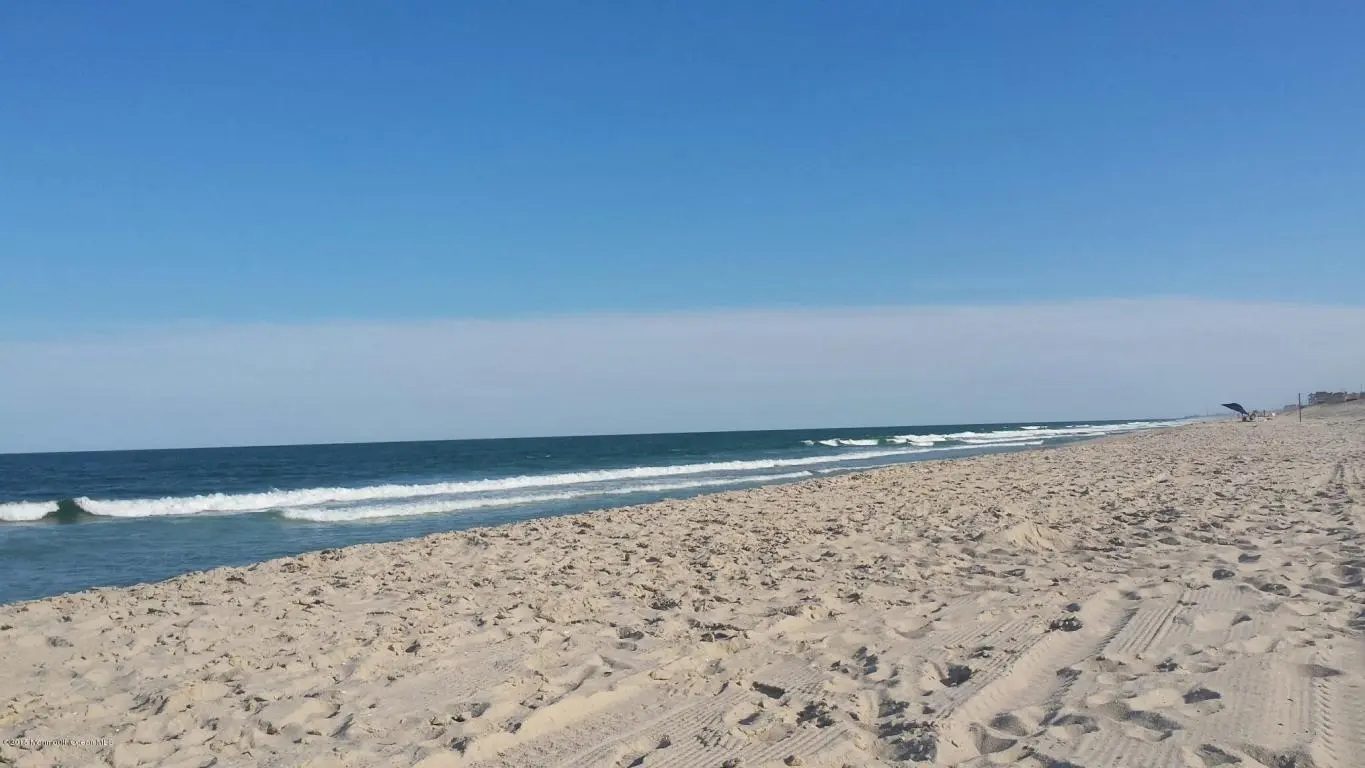 The Atlantic ocean beach with white sand and rolling waves